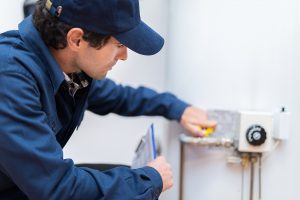 plumber fixing water heater